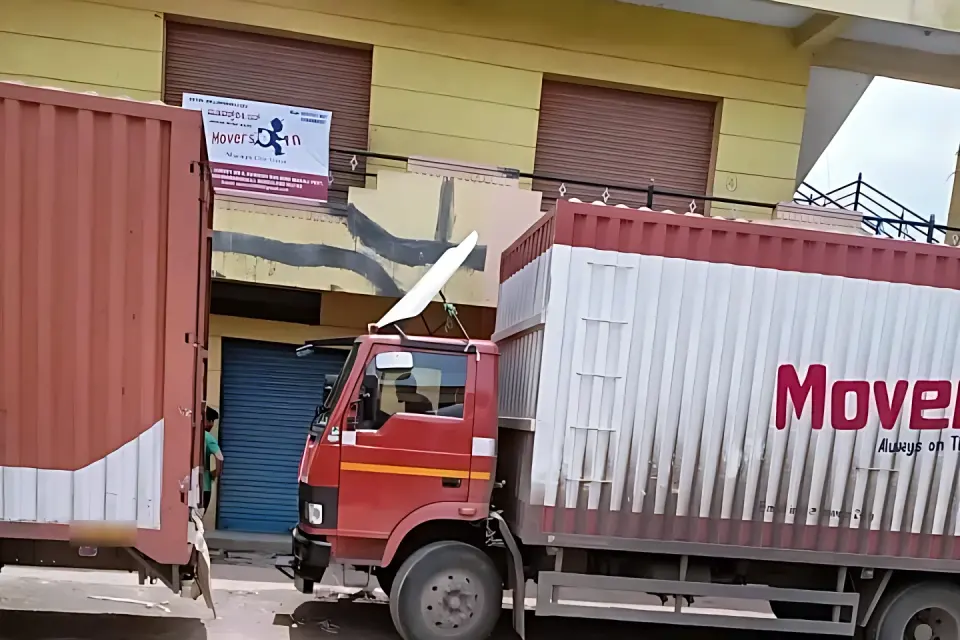 The Movers24 Bengaluru office with company trucks parked in front